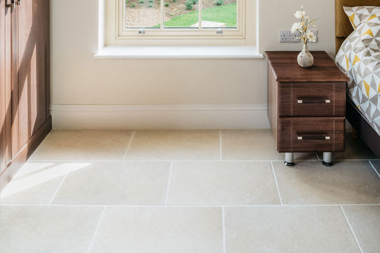 Interior limestone flooring bedroom