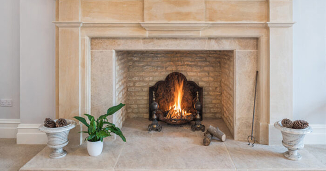 Stone fireplace with plants around it