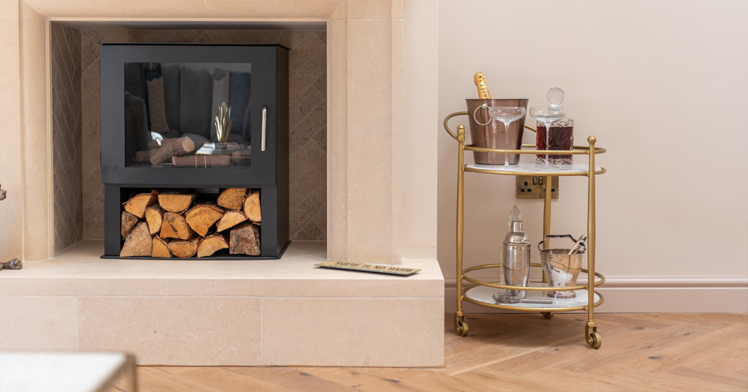 Stone fireplace with drinks tray beside it